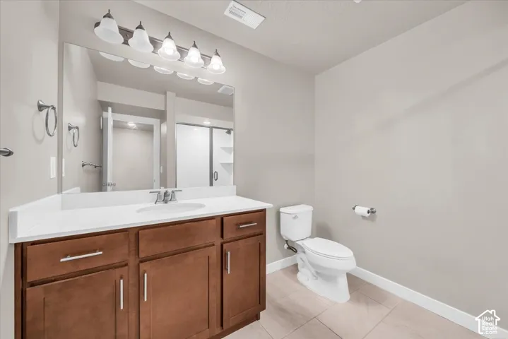 Expansive vanity with wood-finish cabinetry and a white countertop