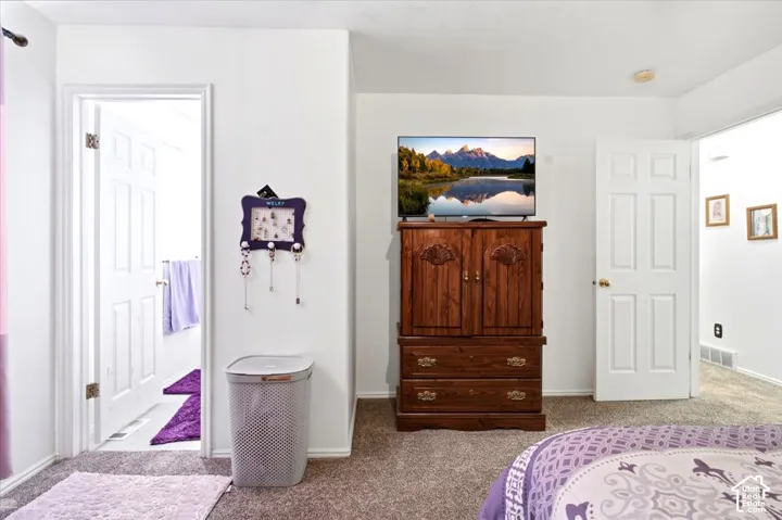 Primary bedroom with attached bathroom