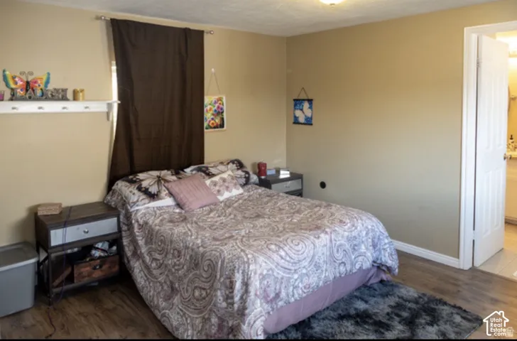 Wood-finish flooring with light-colored walls and white trim