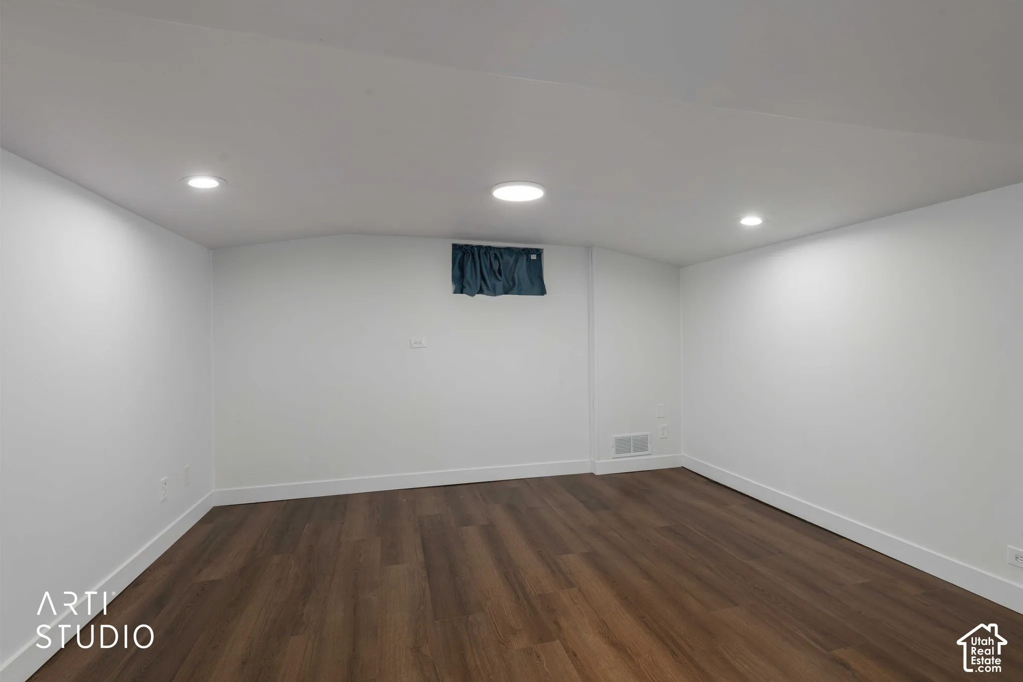 Recessed ceiling lighting, wood-finish flooring, white painted walls, and white trim