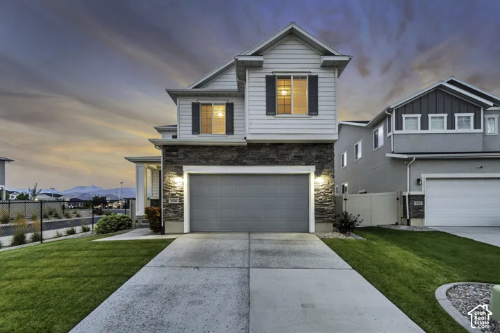 Contemporary exterior with stone facade and horizontal siding