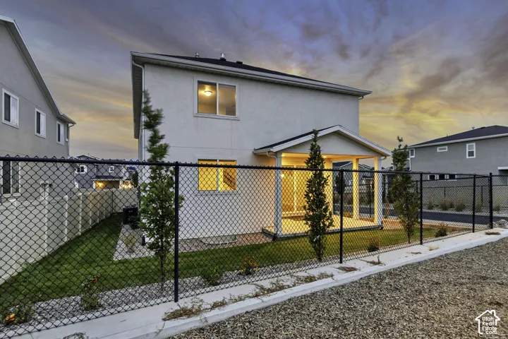 Stucco exterior residence with a covered patio