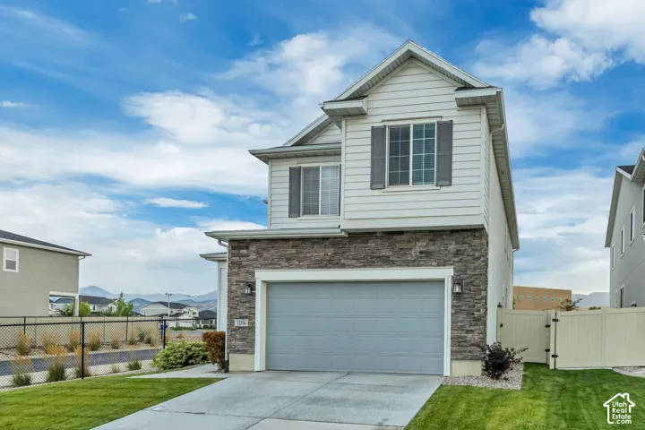 Two-story exterior with horizontal siding and stone veneer accents