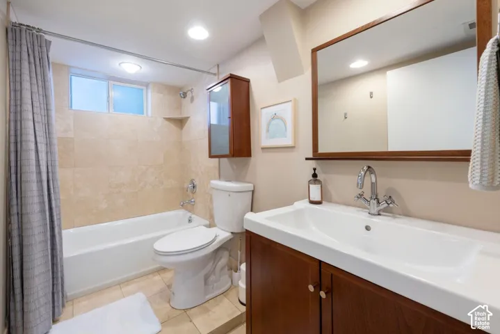 Hardwood vanity with integrated sink, chrome faucet, and framed mirror