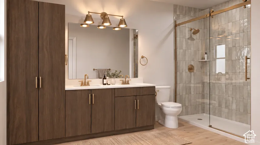 Dual vanity with white countertop, wood-finish cabinetry, and brass fixtures