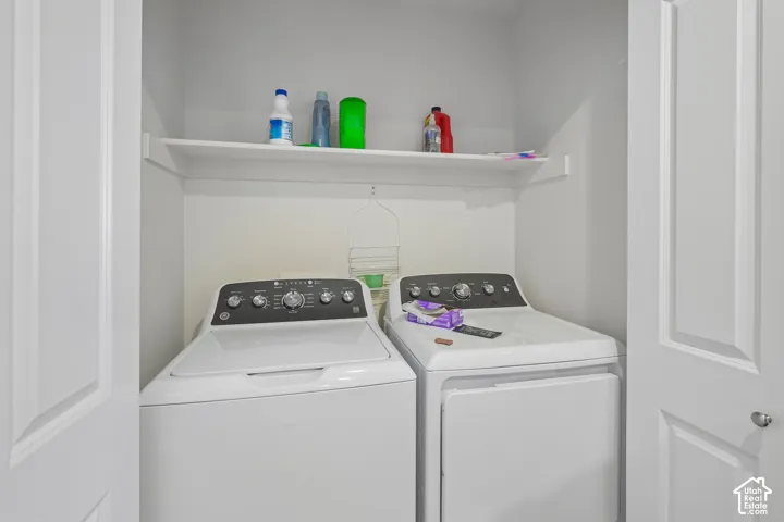 Laundry area with white walls and a built-in shelving unit