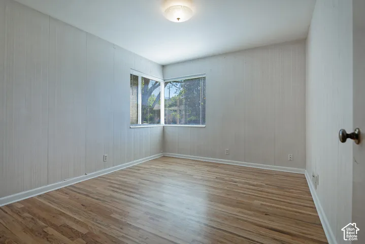 Hardwood flooring, corner windows, flush mount ceiling light