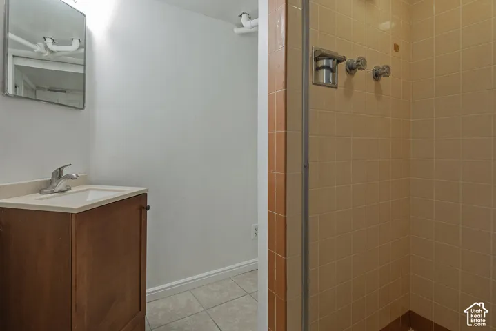 Warm-toned tiled shower stall
