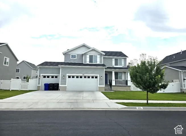 Two-story residence with light gray siding and white trim