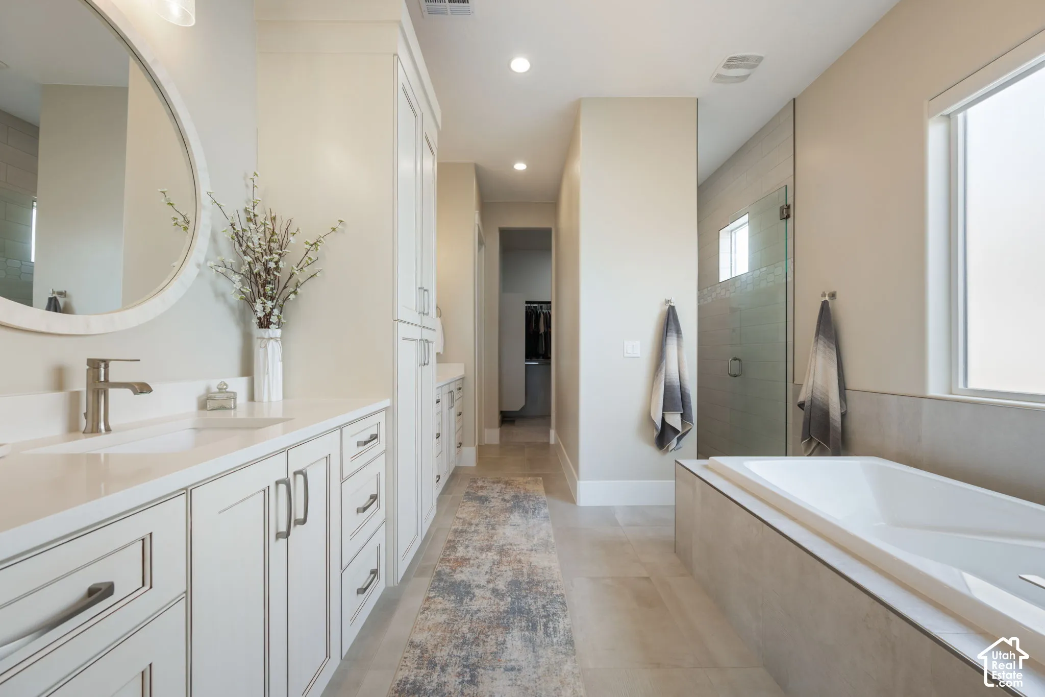Dual vanities with shaker-style cabinetry