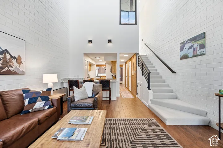 Soaring ceilings and expansive white brick walls create an open atmosphere