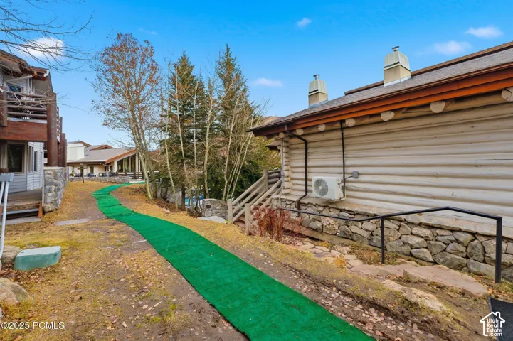 Log-style siding with a stone foundation