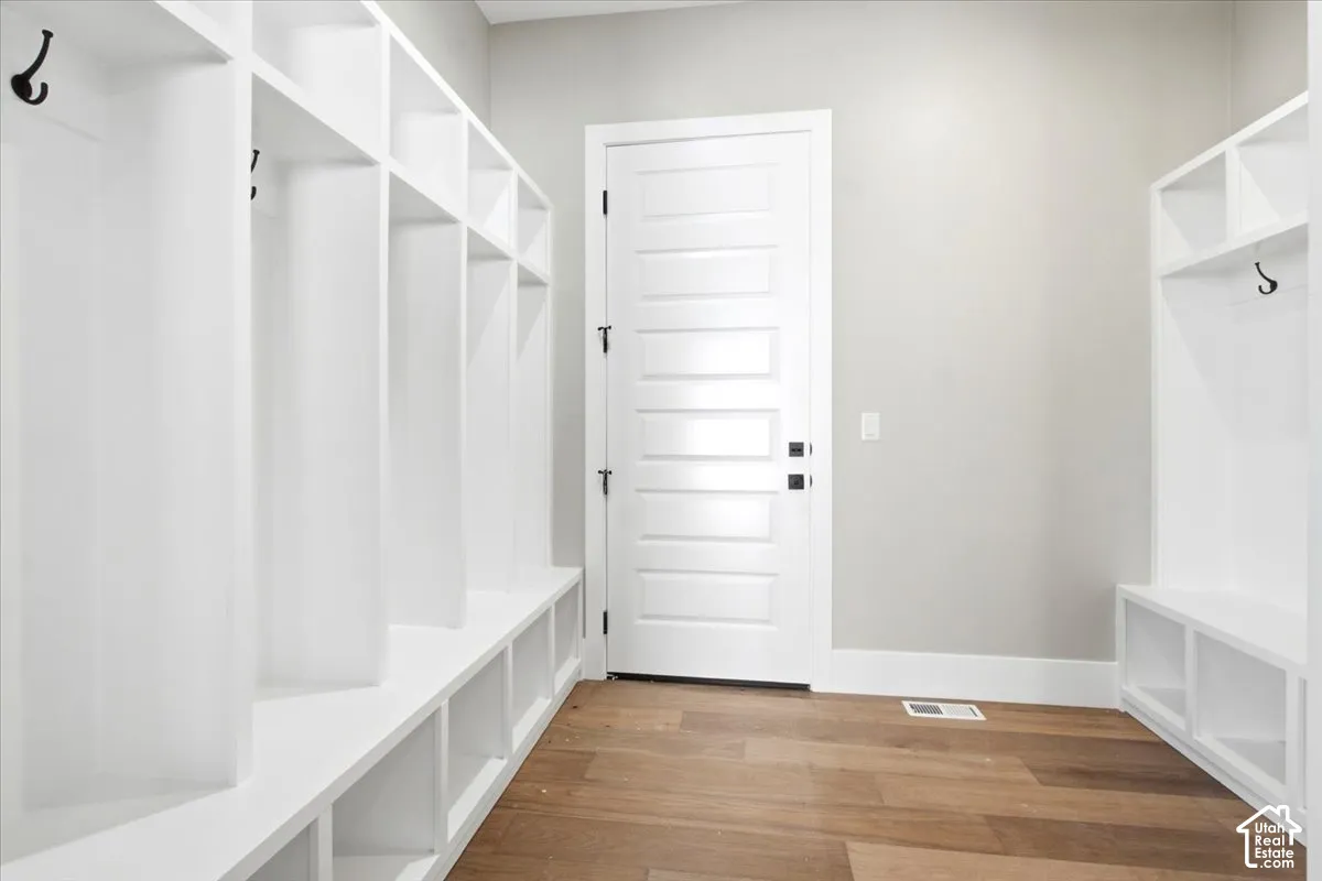Built-in white storage lockers with integrated bench seating