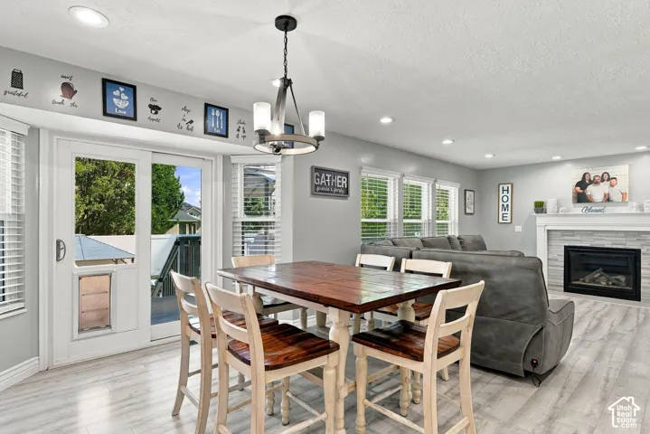 Recessed lighting and a stylish chandelier illuminate the space