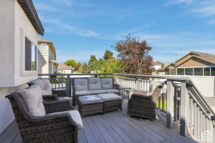 Spacious outdoor deck with a gray wood-finish surface