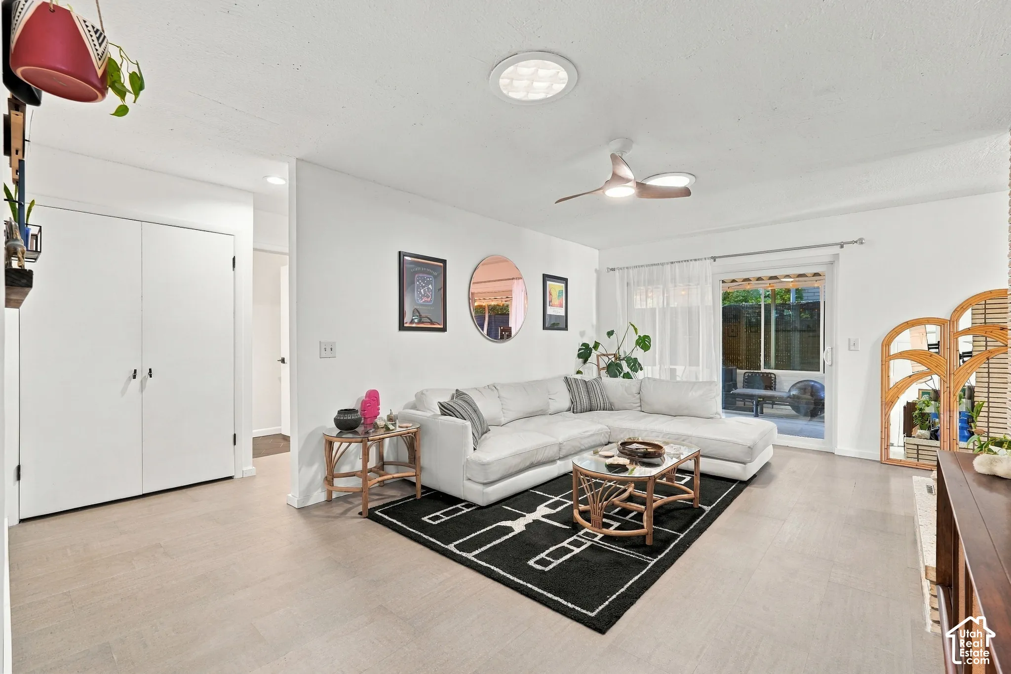 Recessed lighting, wood-finish flooring, sliding glass door, and ceiling fan