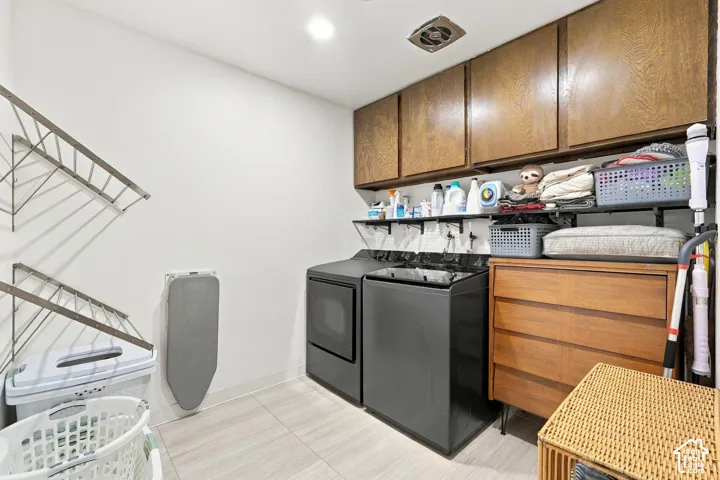 Light-toned tile flooring with white walls and overhead recessed lighting