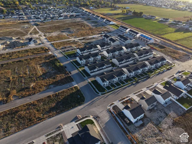 Residential development featuring multiple rows of townhomes and single-family residences