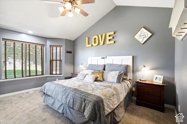 Vaulted ceilings and recessed lighting enhance the spacious atmosphere