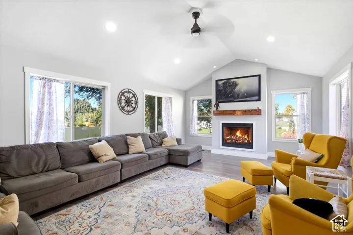 Vaulted ceiling with recessed lighting and ceiling fan