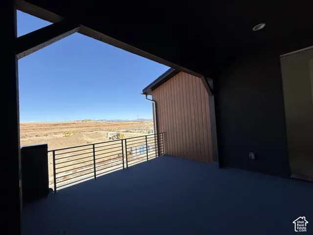 Covered outdoor patio with a flat roof and recessed lighting