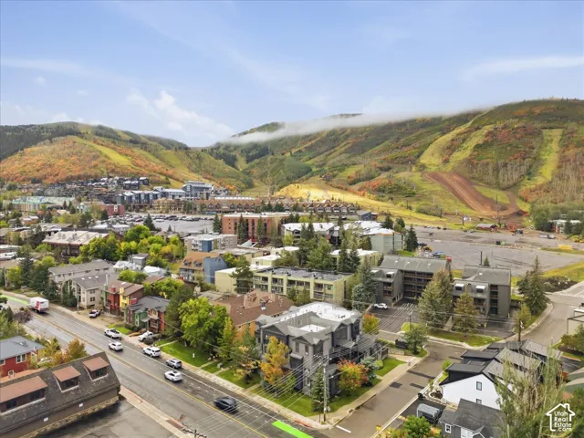 Expansive mountain backdrop with autumn foliage