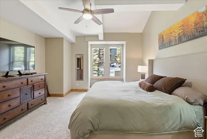 Plush carpeting, recessed lighting, and a ceiling fan with integrated lighting