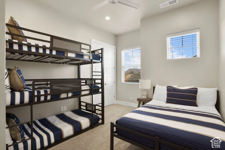 Neutral-toned walls complement the carpeted flooring