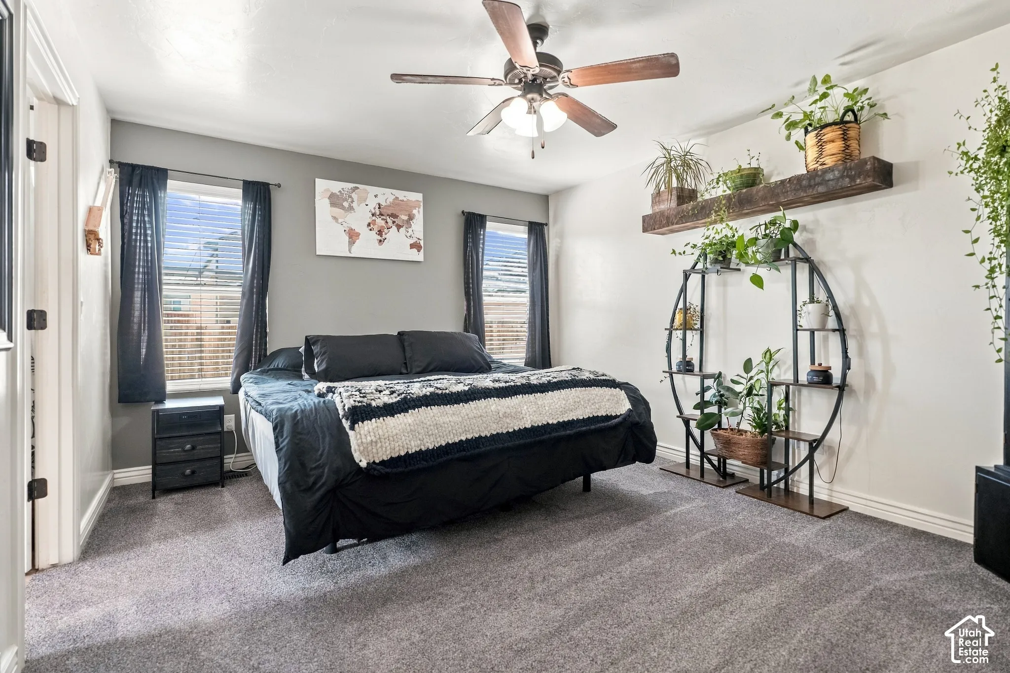 Carpeted bedroom featuring a ceiling fan, two windows with blinds, and recessed lighting
