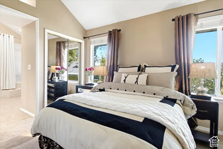 Vaulted ceiling, dual windows, mirrored sliding closet doors, and recessed bathtub