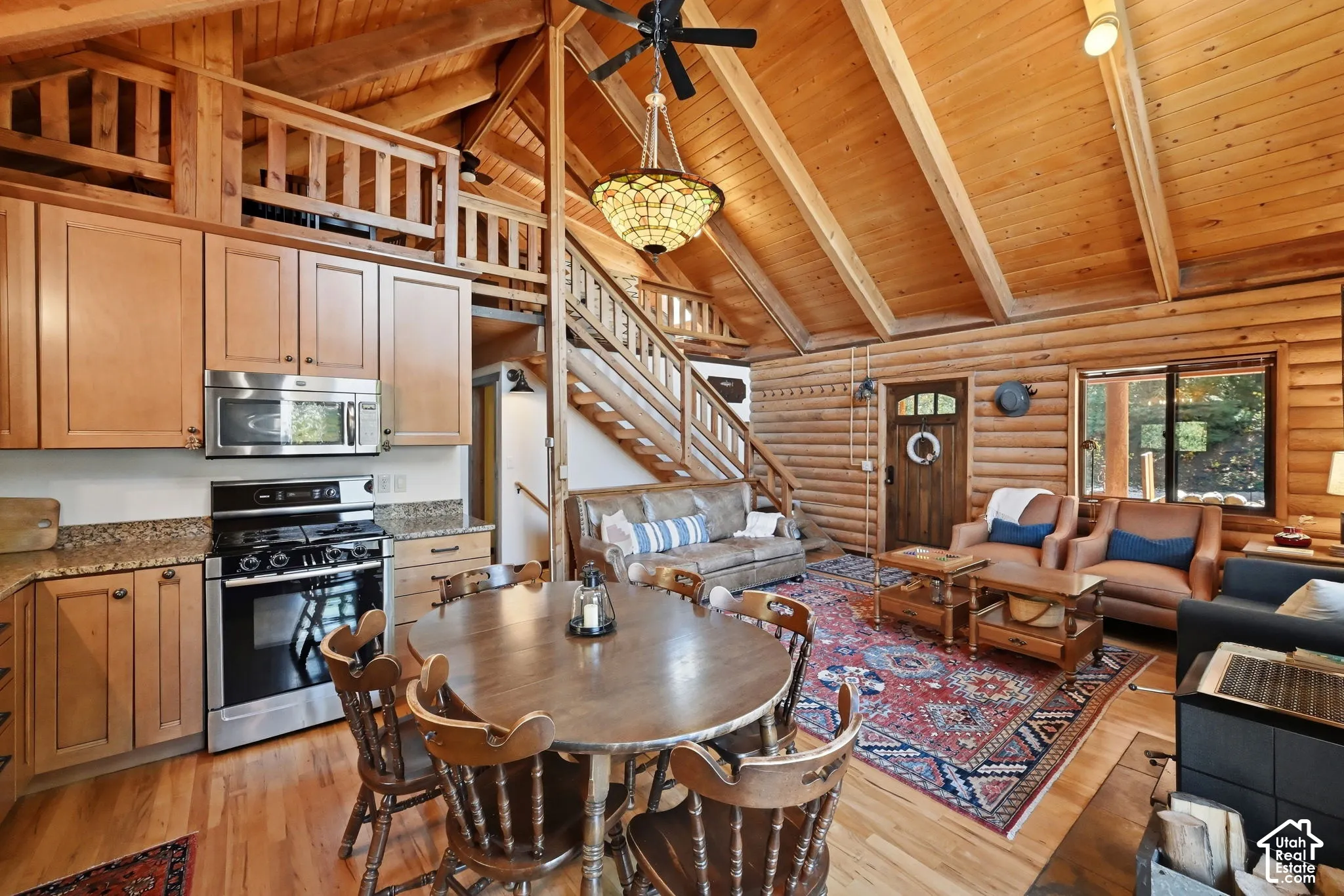 Vaulted wood-paneled ceilings, log walls, and wood-finish flooring