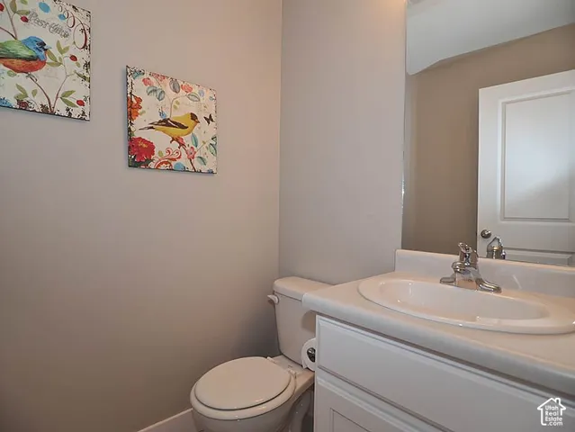 White vanity with an integrated sink and chrome faucet