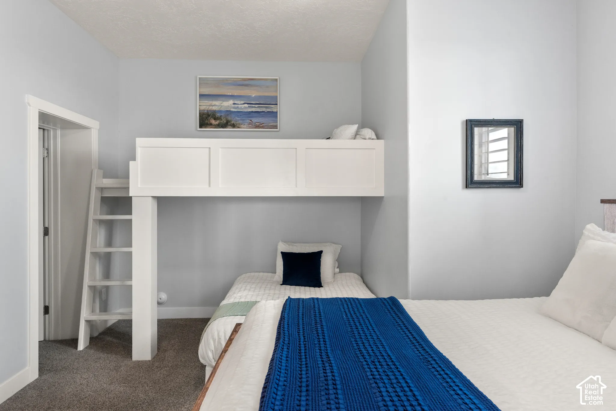 Built-in white bunk bed with ladder