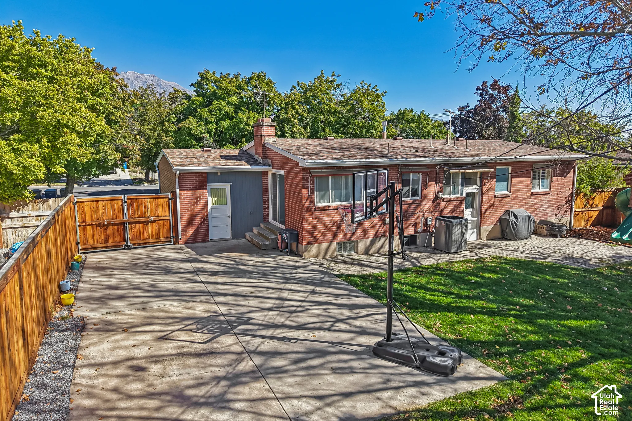 Red brick exterior with a gray siding accent