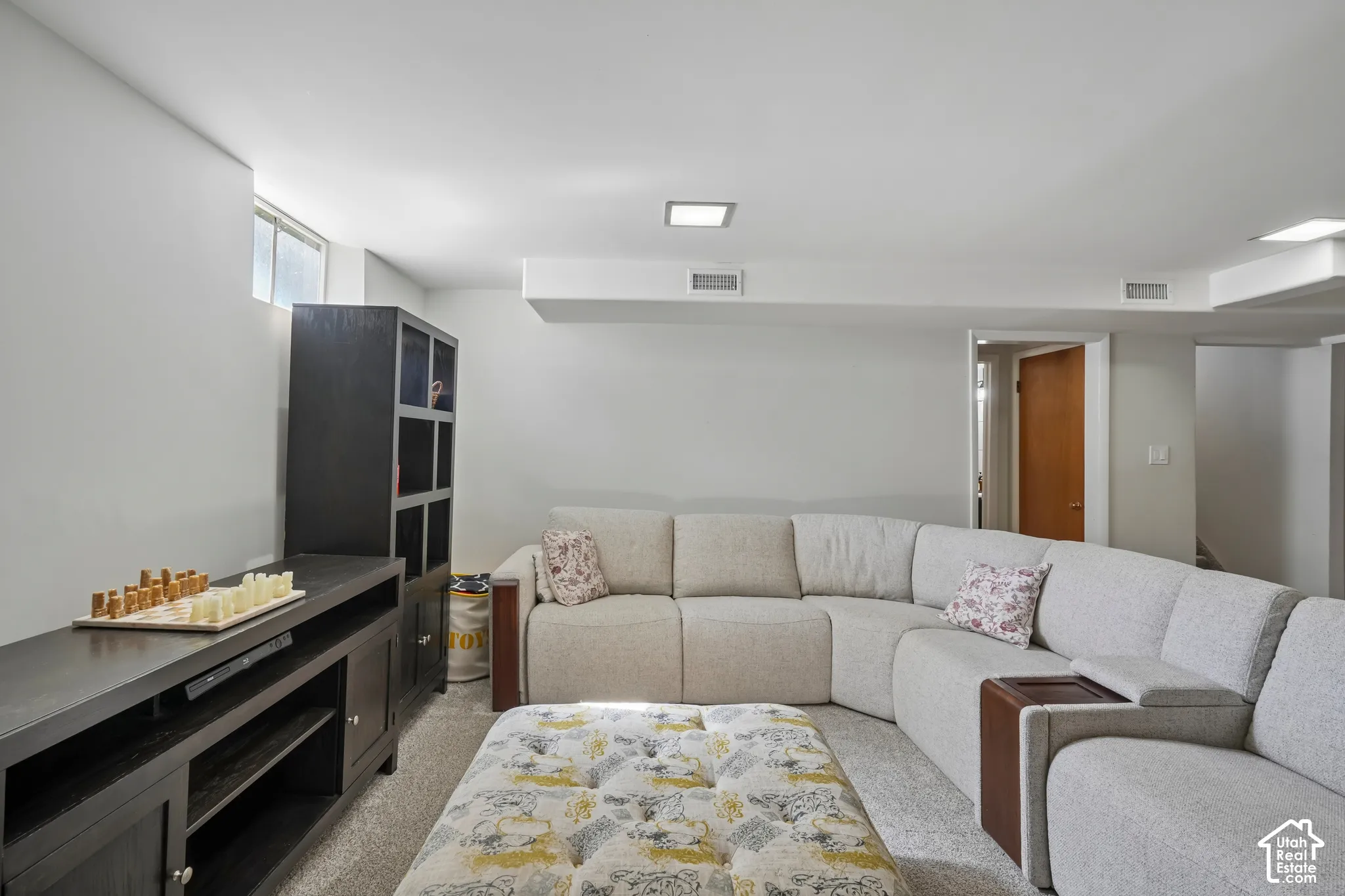 Recessed square lighting and a partial window provide illumination
