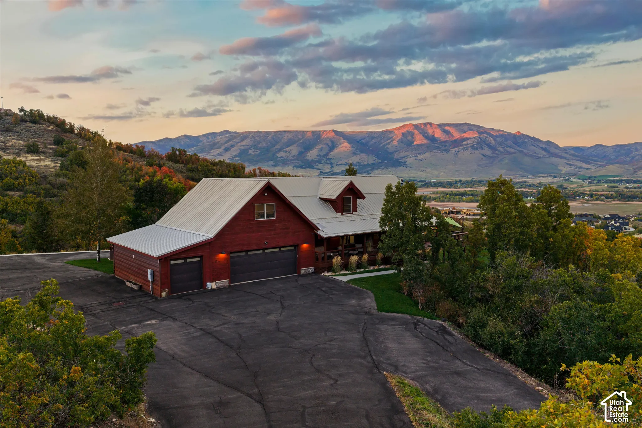 Red siding exterior with a light-colored metal roof