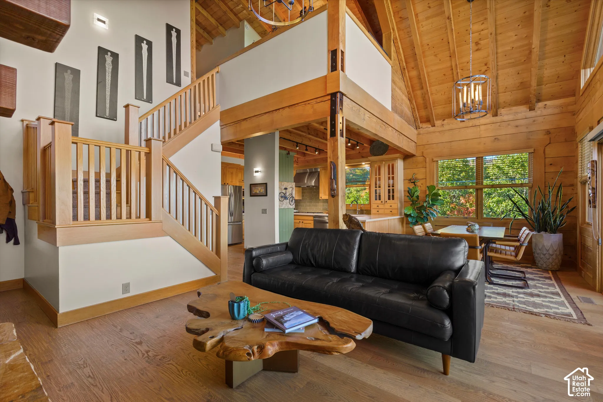 Vaulted wood-finish ceilings, wood-finish flooring, wood-finish staircase, and exposed wood beams