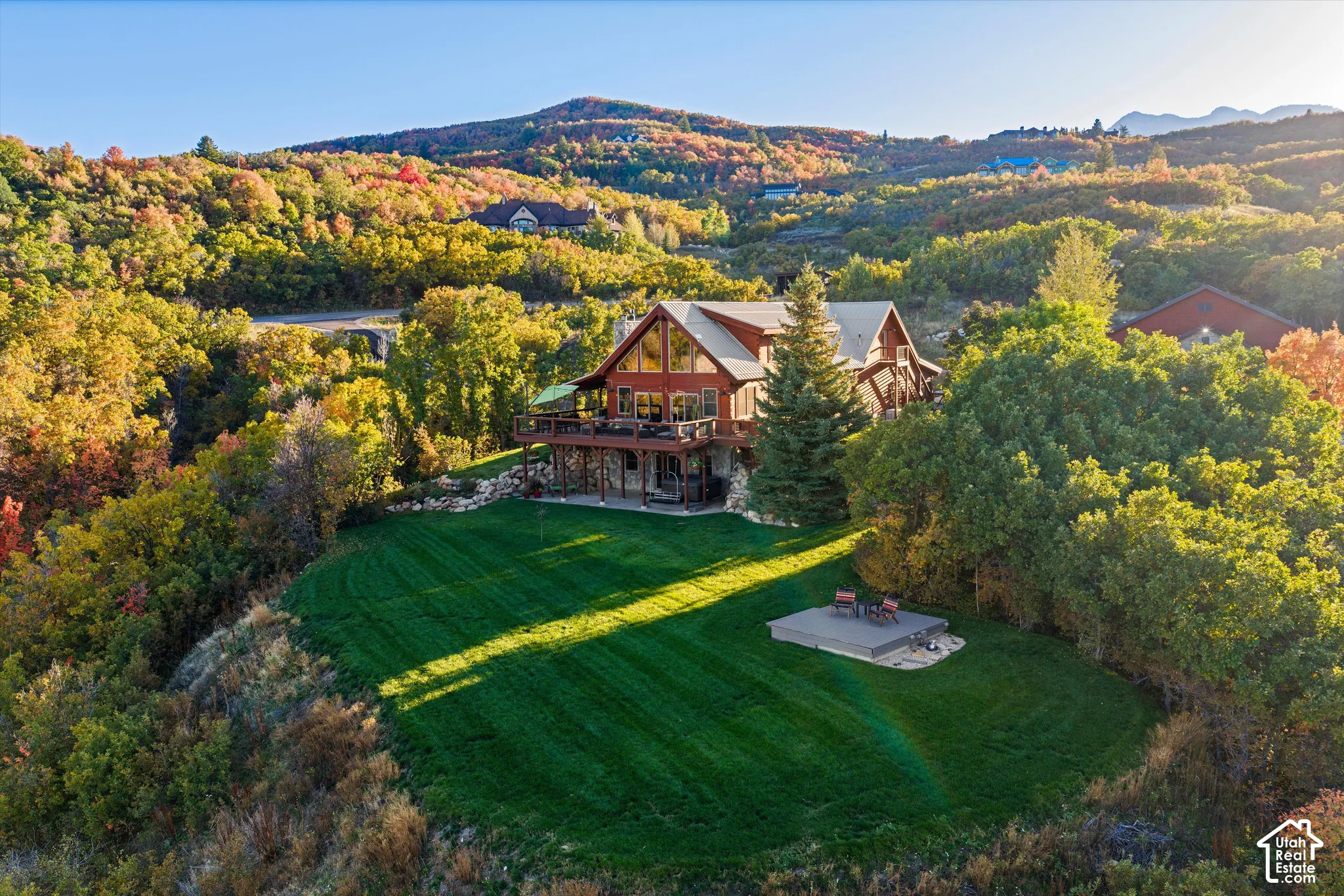 Expansive terraced property with a large, manicured lawn