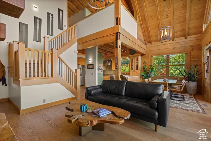 Vaulted wood-finish ceilings, wood-finish flooring, wood-finish staircase, and exposed wood beams