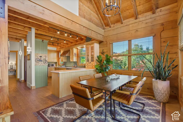Vaulted wood-paneled ceilings, natural wood walls, and wood-finish flooring