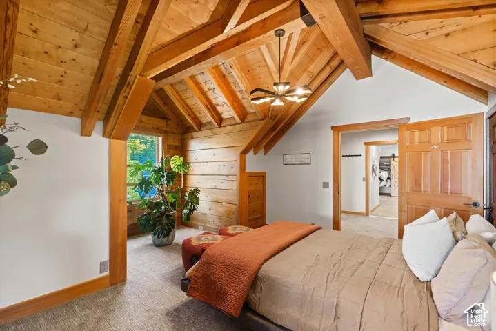 Vaulted wood-paneled ceiling with exposed beams