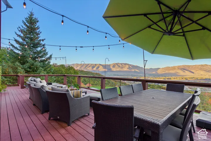 Expansive outdoor deck featuring composite decking, string lights, and a railing system