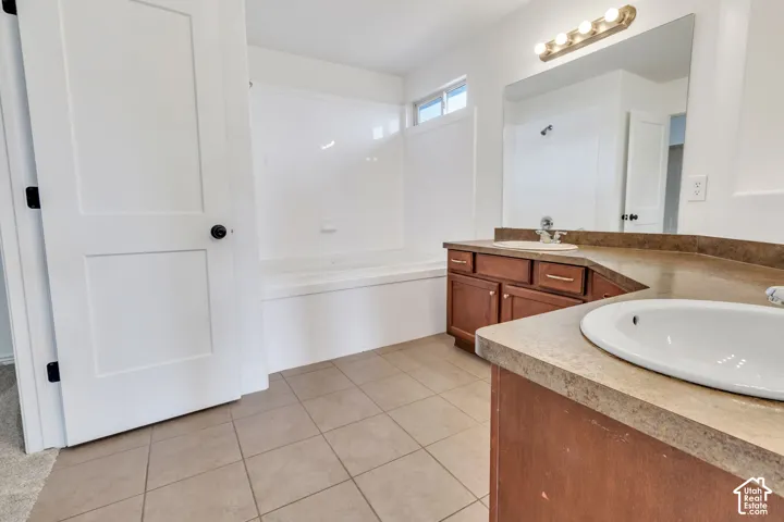 Dual vanity with integrated sinks, wood-finish cabinetry, and a spacious countertop