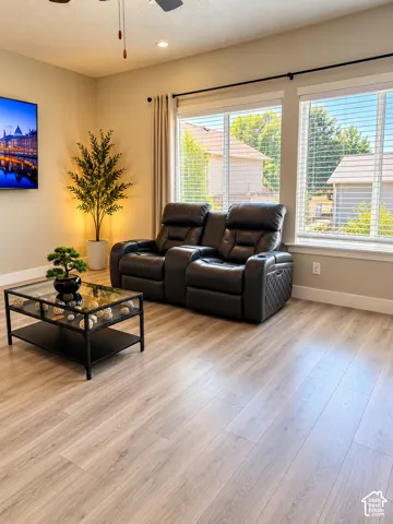 Wood-finish flooring, recessed lighting, and a ceiling fan