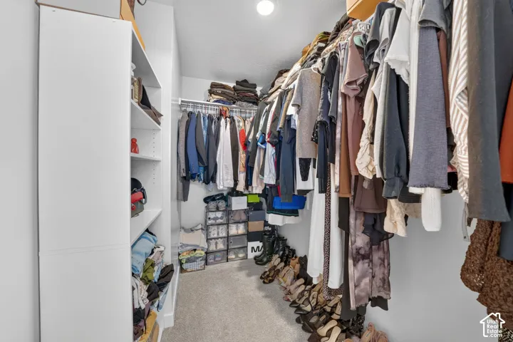 Walk in closet in primary bedroom
