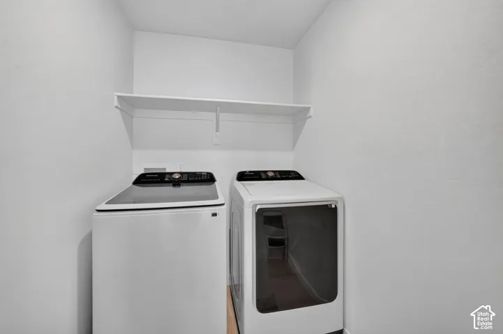 Laundry room upstairs next to your primary bedroom