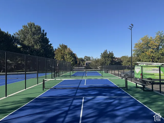 Multiple outdoor courts featuring blue and green surfacing