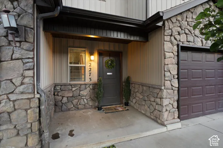 Stone veneer and vertical siding exterior
