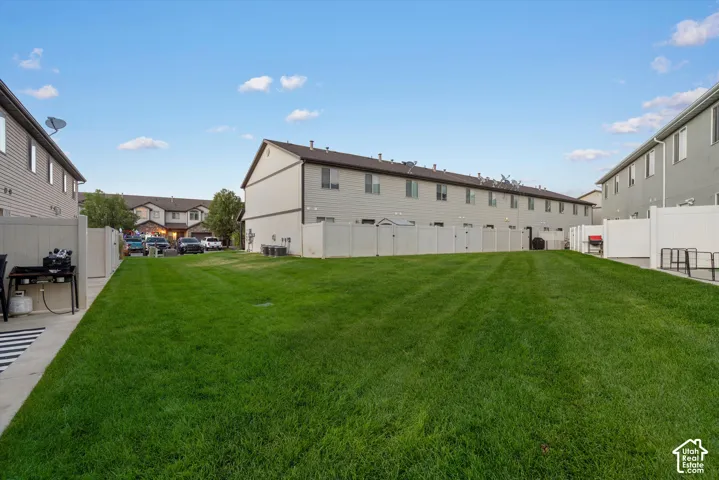 View from back patio with rare open view of common grass area instead of back neighbors