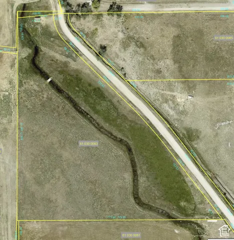 Aerial Map. Depicting property boundaries and features including a road and natural watercourse